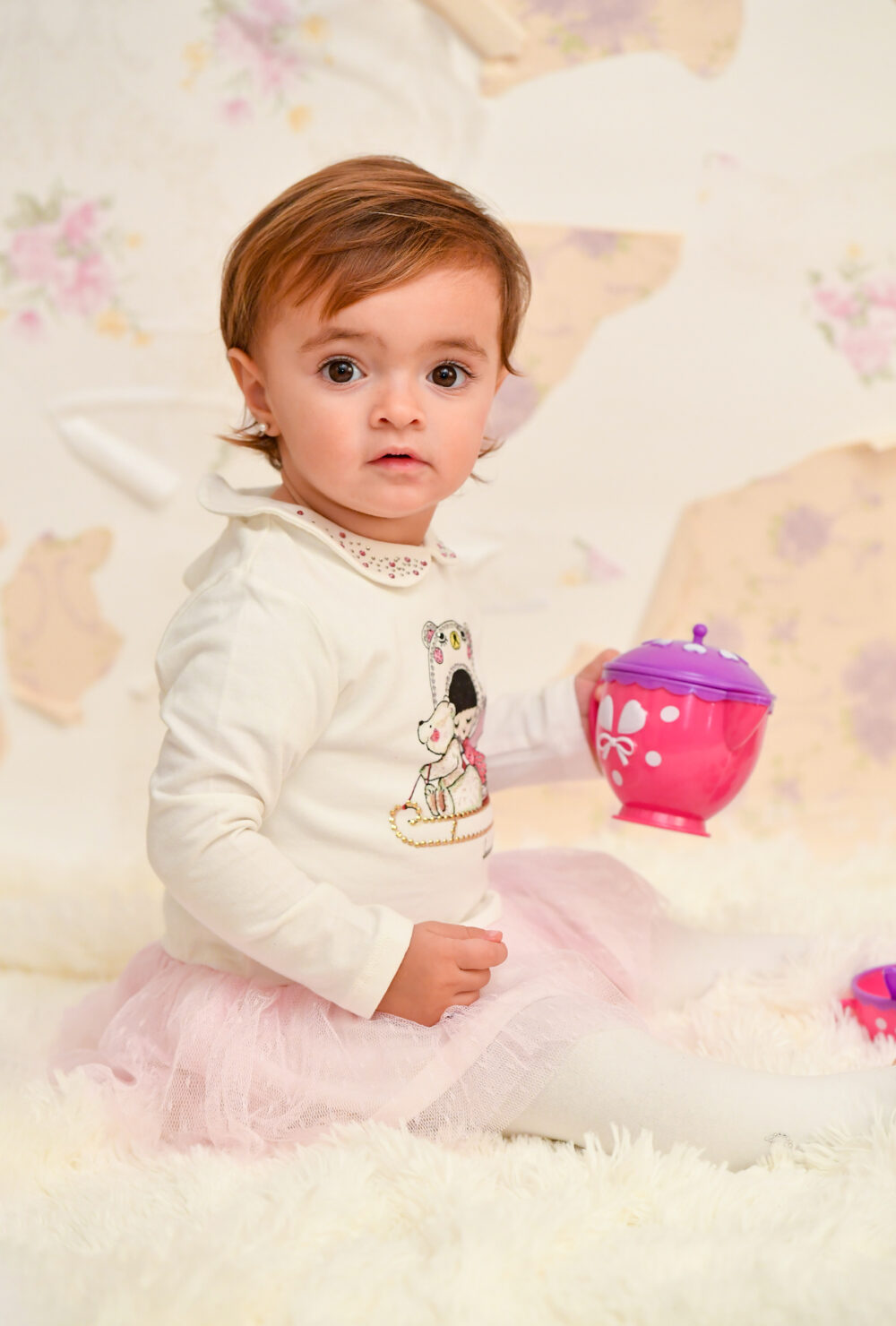 Servizio fotografico bimbi primo compleanno set colorato in studio